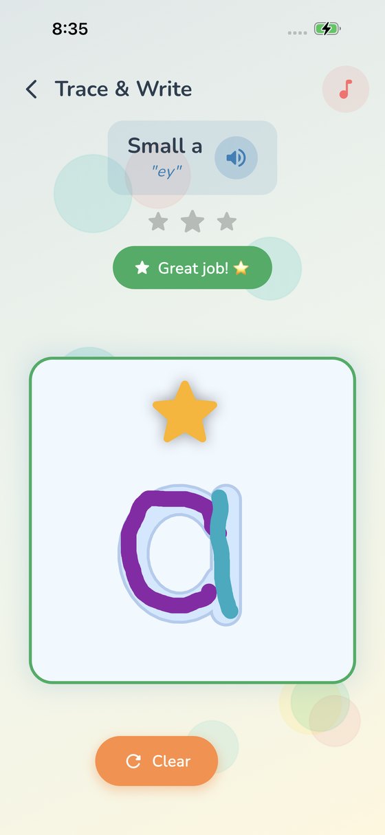 A completed lowercase a traced in purple and teal crayon with a gold star